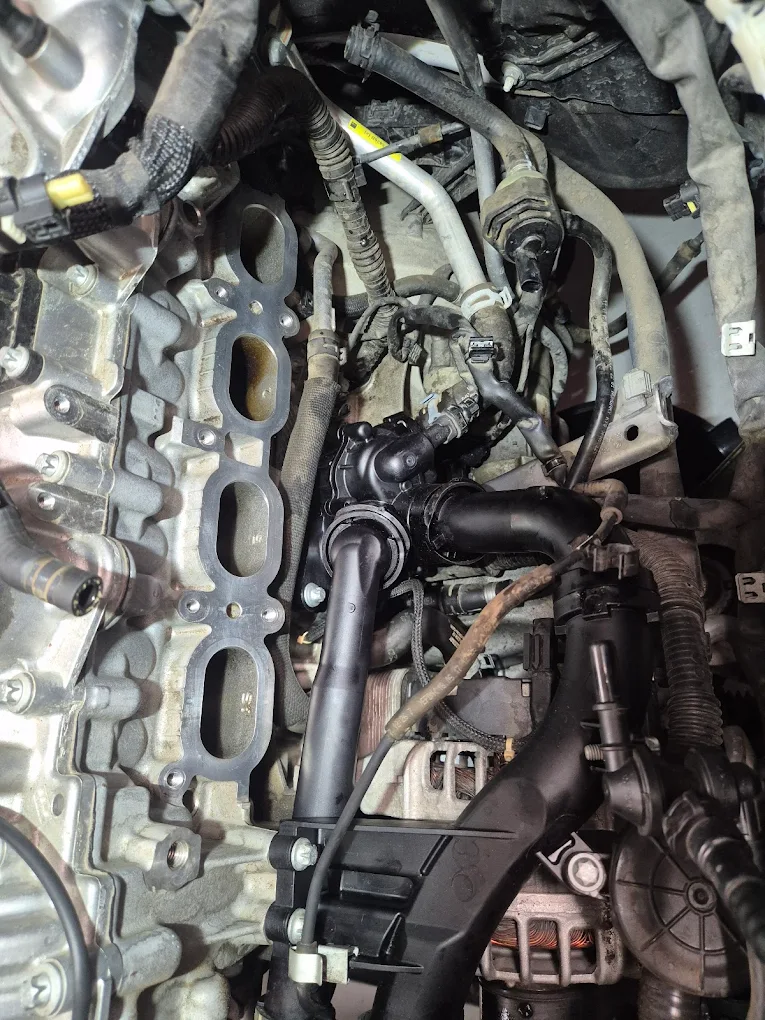 Mercedes-Benz engine components showcasing intricate assembly, including hoses and connectors